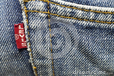 closeup detail of levi `s red tag on levi `s jeans. Editorial Stock Photo