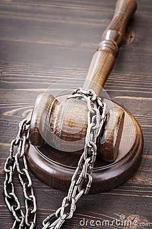 Chained judge wooden gavel Stock Photo