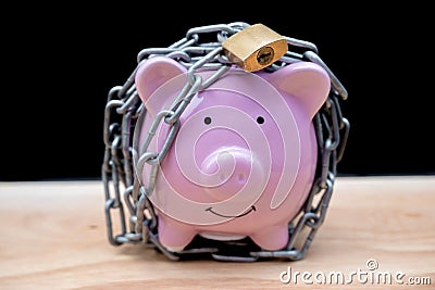 Chained piggy bank and lock money savings with chain and keys. Money security concept Stock Photo