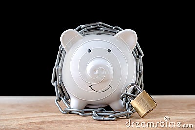 Chained piggy bank and lock money savings with chain and keys. Money security concept Stock Photo