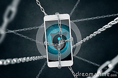 Chained smartphone with antivirus shield. Stock Photo