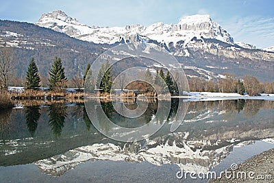 Chaines des Aravis reflected in lake Stock Photo