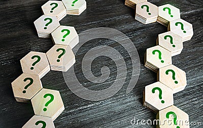Chains of blocks with a question mark. Unknown facts. Curiosity, exploration. Questions and problem solving. Technologies and Stock Photo