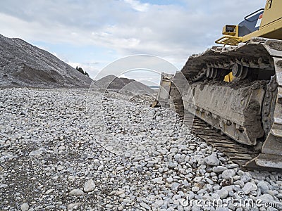 Chains of a bulldozer in the empty Forggen lake Stock Photo