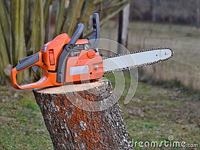 Chainsaw on a stump Stock Photo