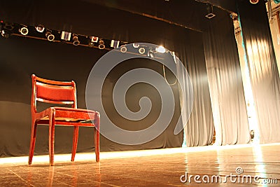 Chair on empty theatre stage Stock Photo