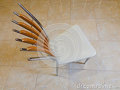 Metal chair with leatherette seat and wooden back, top view Stock Photo