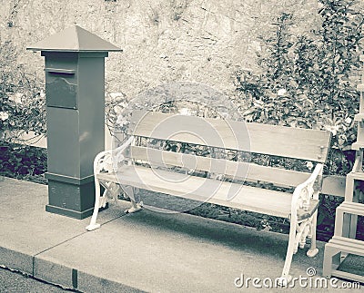 Chair and postbox roadside in garden, vintage tone Stock Photo