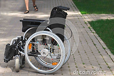 A chair for sedentary people. An accessible environment in the world. Free movement for the disabled. Stock Photo