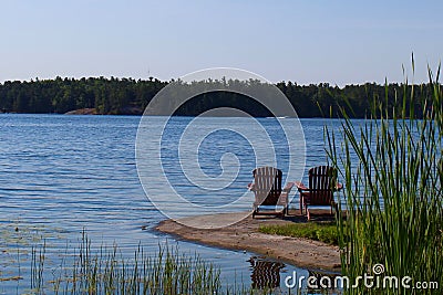 Chairs looking over beautiful lake view Stock Photo