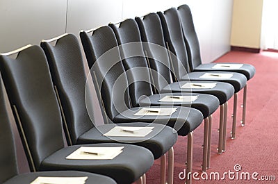 Chairs with Seminar Manuscripts and Pens for Corporate Trainings Stock Photo