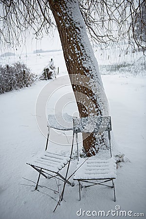 Chairs in snow Stock Photo