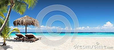 Chairs And Umbrella In Tropical Beach Stock Photo