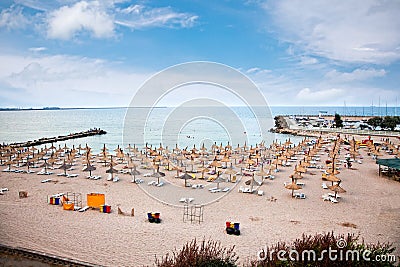 Chaise longue on the beach at sunset ,Constanta, Romania. Stock Photo