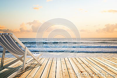 Chaise longue wooden floor seaside Stock Photo