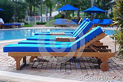 Chaise Lounge Chairs by the Pool Stock Photo