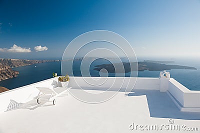 Chaise lounge on the terrace with sea view. Santorini island, Gr Stock Photo