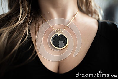 Chakra medallion hanging on the woman`s chest Stock Photo