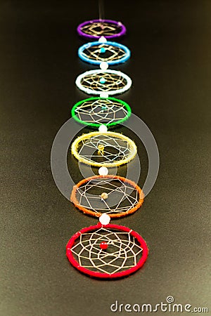 Chakras on a black background. Decoration on the wall of seven chakras. Stock Photo