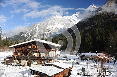 Chalet in French Alps in Chamonix with a panorama of mountains covered in snow in winter Editorial Stock Photo