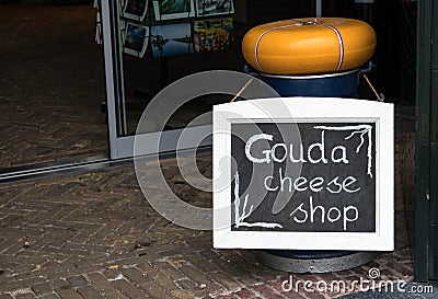 Chalk and blackboard sign advertising a cheese shop at shop entrance Editorial Stock Photo