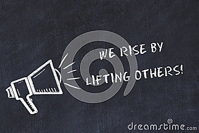 Chalk board sketch with loudspeaker and motivational phrase we rise by lifting others Stock Photo