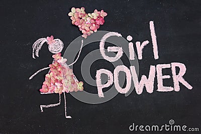 Chalk drawing woman icon dressed in nature flowers with heart from flowers. GIRL POWER inscription on chalkboard or blackboard. Le Stock Photo