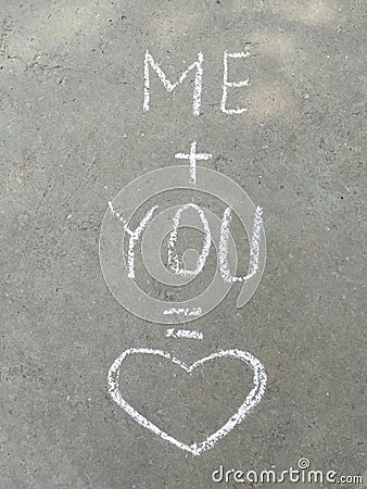 Chalk inscription on the asphalt me plus you is love. heart, message, recognition, summer, wedding, valentine. card Stock Photo