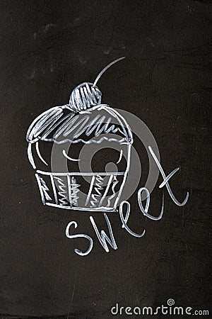 Chalk inscription sweet cupcake with cherry Stock Photo