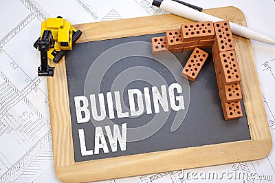 Chalkboard on a construction plan with paragraph and building law Stock Photo