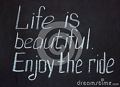 Chalkboard lettering `Life is beautiful. Enjoy the ride` Stock Photo