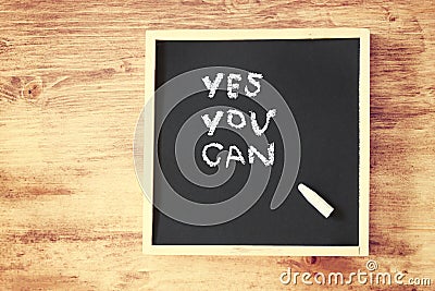 Chalkboard with the phrase yes you can Stock Photo