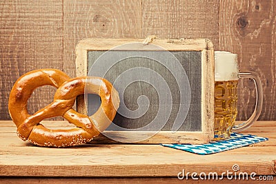 Chalkboard, pretzel and beer glass for Oktoberfest celebration Stock Photo