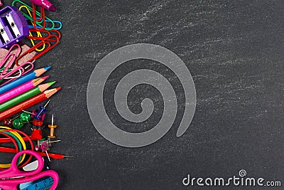 Chalkboard with school supplies side border Stock Photo