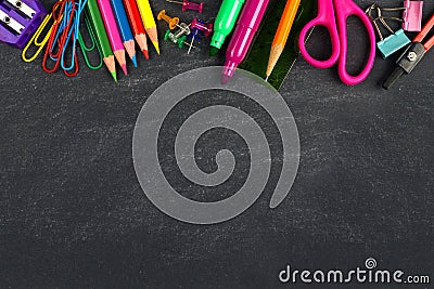 Chalkboard with school supplies top border Stock Photo