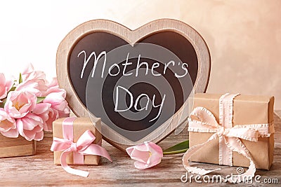 Chalkboard with text MOTHER`S DAY, tulips Stock Photo