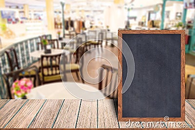 Chalkboard wood frame blackboard sign menu on wooden table. Stock Photo