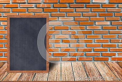 Chalkboard wood frame, blackboard sign menu on wooden table and brick wall background. Stock Photo