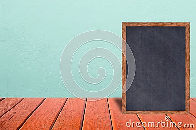 Chalkboard wood frame, blackboard sign menu on wooden table and vintage cooler background. Stock Photo