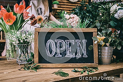 Chalkboard with word Open in floral shop Stock Photo