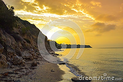 Colorful sunrise skies Chalkidiki beach at sunrise Aegean Sea Greece Stock Photo