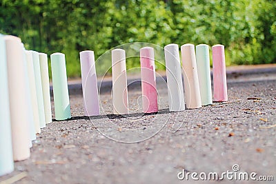 Chalks for painting stand on the asphalt Stock Photo