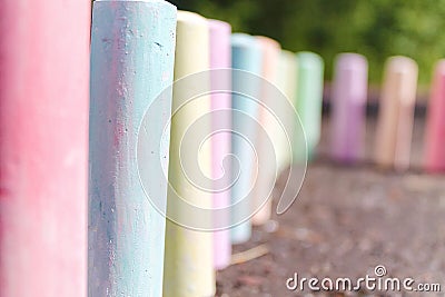 Chalks for painting stand on the asphalt Stock Photo