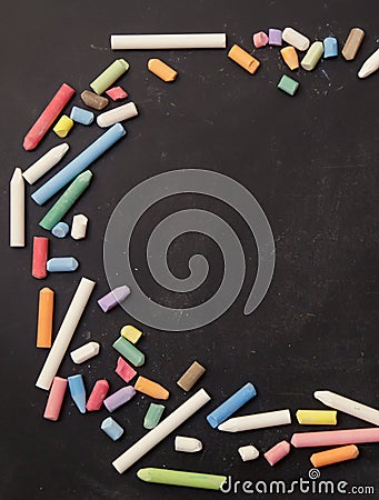 Chalks in a variety of colors arranged on a black background Stock Photo