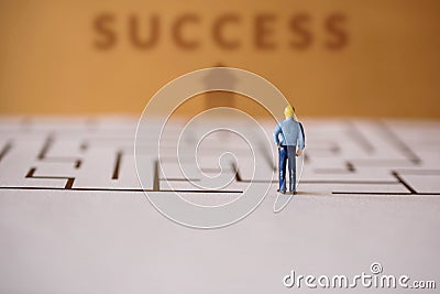 Challenge Concept. present by Miniature Figure of Businessman st Stock Photo