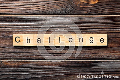 CHALLENGE word written on wood block. CHALLENGE text on wooden table for your desing, concept Stock Photo