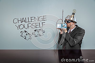 Challenge yourself text with vintage businessman Stock Photo