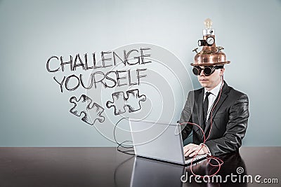 Challenge yourself text with vintage businessman using laptop Stock Photo