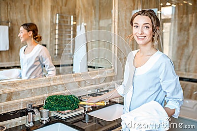 Chambermaid in the hotel bathroom Stock Photo