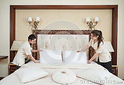 Chambermaid woman team at hotel service Stock Photo